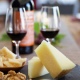 Wine and cheese on a table